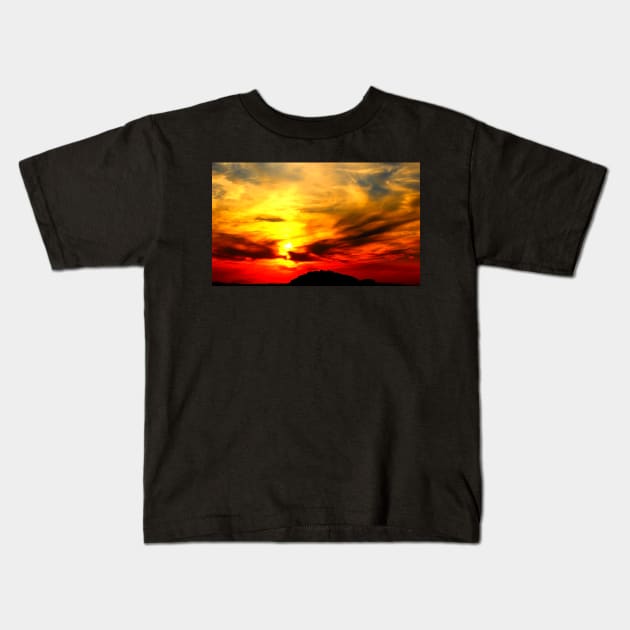 Apocalyptic scenery with a bath of violent clouds in the sunset sky full of raging red and yellow colours Kids T-Shirt by KristinaDrozd